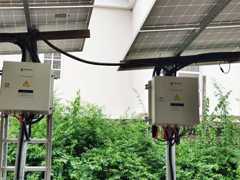 WHC PV Combiner Boxes at a Solar Installation WHC PV combiner boxes beneath a solar array for equipment scope review